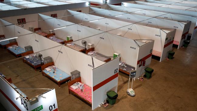 Beds at Changi Exhibition Centre, which now houses recovering or early COVID-19 patients with mild symptoms. Picture: Reuters