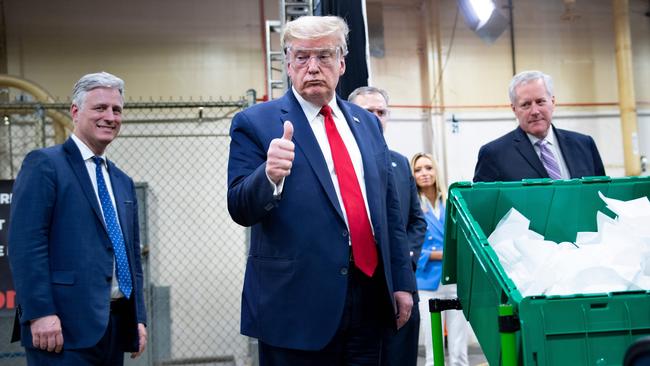 US President Donald Trump stays mask-free as he tours a Honeywell factory producing N95 masks in Arizona. Picture: AFP