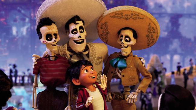 In a scene from Disney Pixar's animated film Coco, aspiring musician Miguel (voiced by Anthony Gonzalez) journeys through the Land of the Dead in search of his idol Ernesto de la Cruz (centre, Benjamin Bratt). ©2017 Disney Pixar. All Rights Reserved.