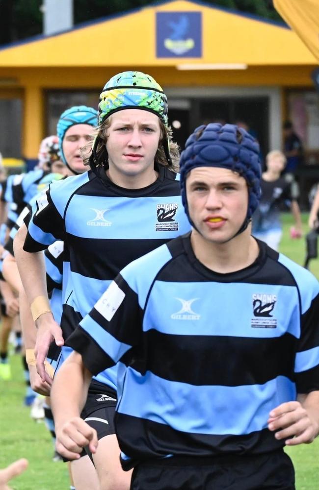 Maroochydore Swans players Will Graham (front) and Patrick Edwards lead their team out at the 2022 King of the Country rugby union tournament.