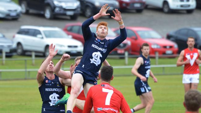 South's Joseph Haines flies high against North Adelaide. Picture: AAP/Brenton Edwards