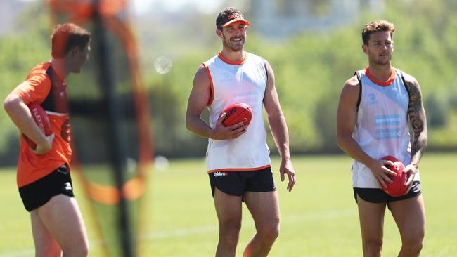 Shane Mumford, middle, at Giants training over summer.