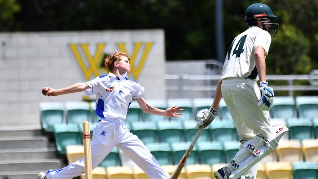 One of St Edmund's College’s bowlers rolling