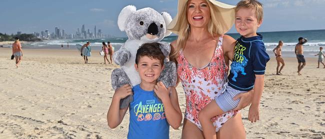 Gold Coaster Michelle Massey and her sons Hudson and Knoxy will join the Gold Coast Beach Parade next month . The parades hopes to  create a world record for the  most people in a beach parade wearing specially designed koala ear visors . Picture: John Pryke Photographer.