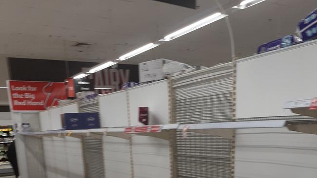 Coles at Waratah. Shelves bare. Toilet paper rush. Credit: facebook