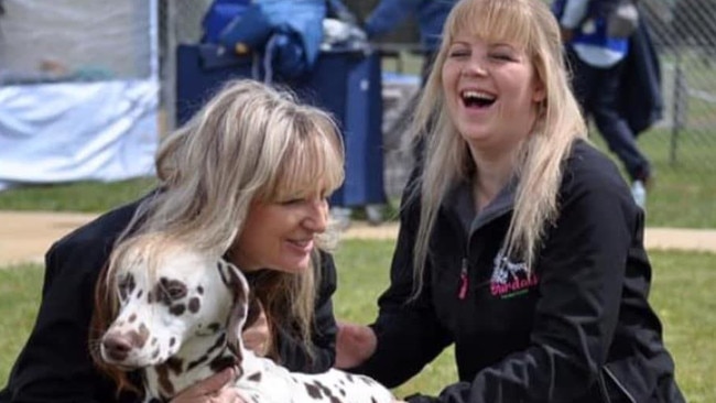 Katy Innes and her mother Yanina Smith with Katy's dog Vinnie. Katy, 25, is recovering from a brain bleed in hospital. She is 31 weeks pregnant and has made progress, but has a huge road ahead. Source: SUPPLIED.