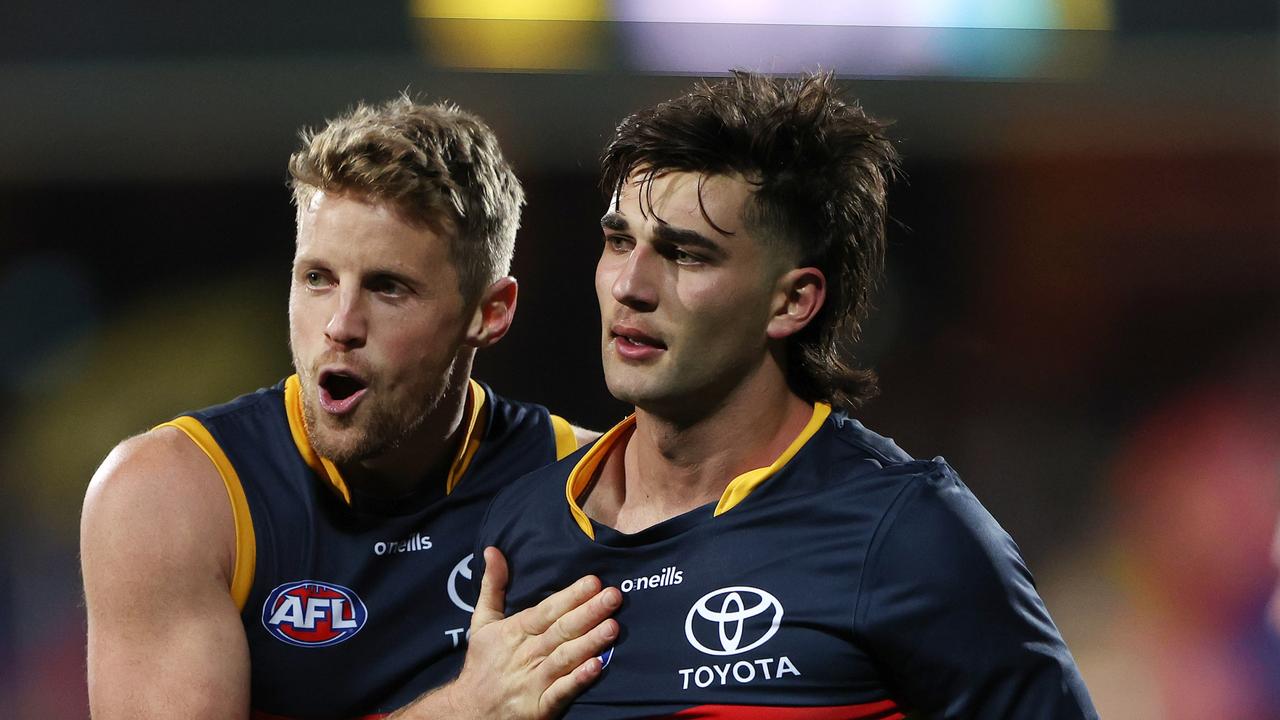ADELAIDE, AUSTRALIA - JULY 15: Rory Sloane of the Crows tries to calm down Josh Rachele of the Crows during the 2023 AFL Round 18 match between the Adelaide Crows and the GWS Giants at Adelaide Oval on July 15, 2023 in Adelaide, Australia. (Photo by Sarah Reed/AFL Photos via Getty Images)