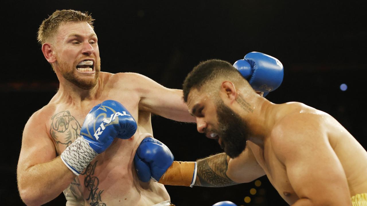 Bryce Jones and Daniel Suluka- Fifita go punch for punch in their heavyweight bout. Picture: Mark Evans/Getty Images