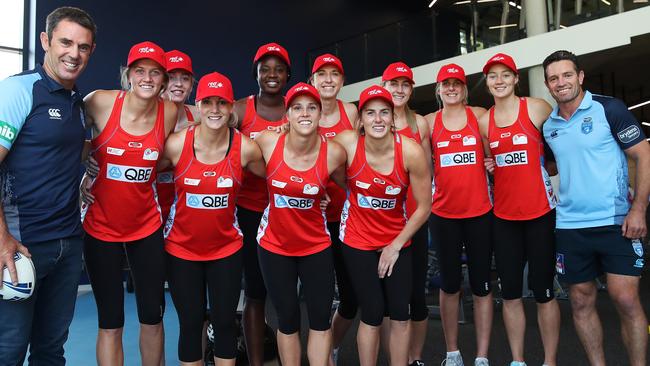 NSW State of Origin coach Brad Fittler (left) and assistant coach Danny Buderus (right) with the NSW Swifts players on Wednesday. Picture. Phil Hillyard