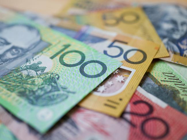 Australian money background showing $100, $50 and $20 notes with a shallow depth of field.