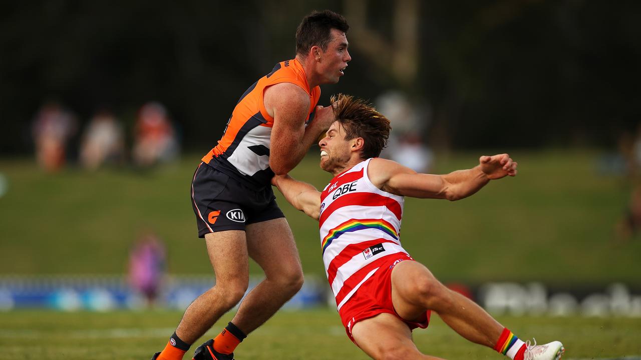 Dane Rampe of the Swans attempts a tackle during the Marsh Community Series