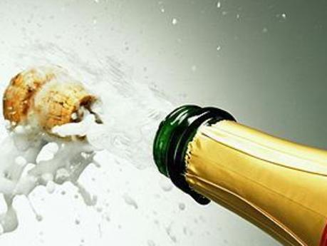 Champagne bottle popping cork, close-up