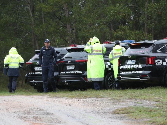 Police endured rain on Wednesday’s search. Picture: David Crosling