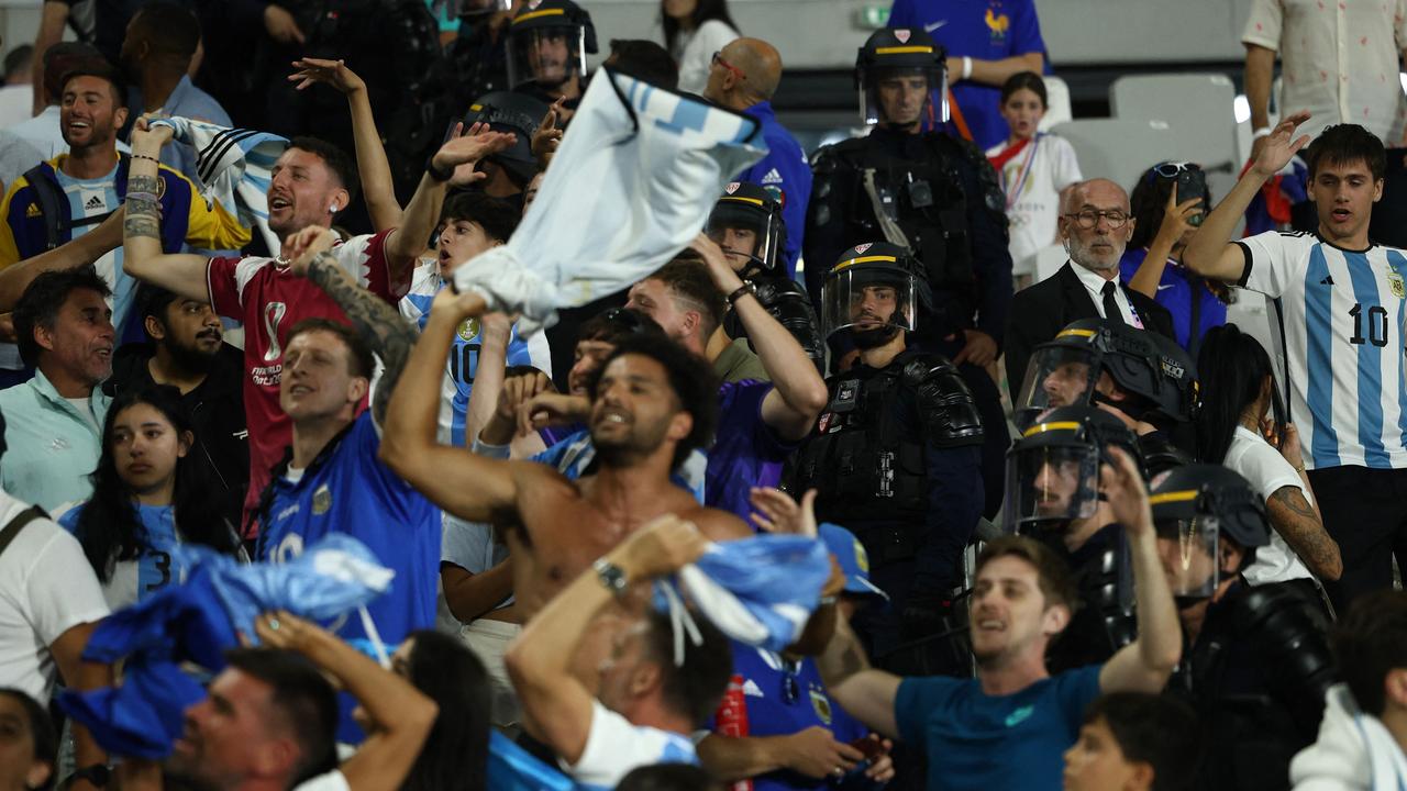 Police forces stand guard in the tribunes at the end of the match. Picture: AFP