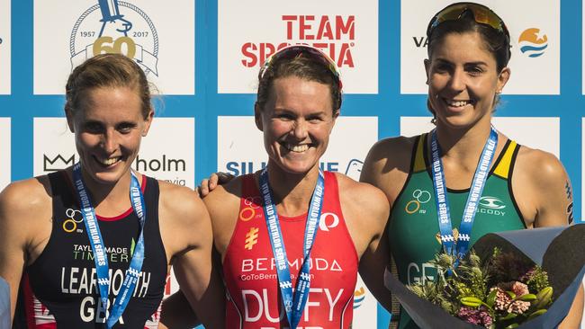 Jessica Learmonth of Great Britain, Flora Duffy of Bermuda, and Ashleigh Gentle of Australia on the winner's podium.