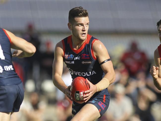 SANFL: North Adelaide v Norwood at Prospect Oval. Norwood's Matthew Nunn evades North's Aidan Tropiano. 25 April 2019. Picture Dean Martin