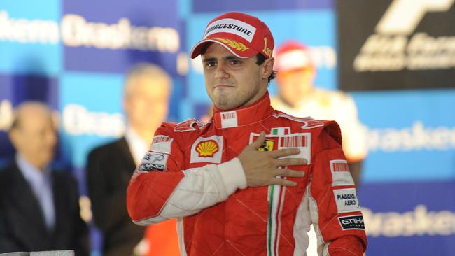 Ferrari Formula One driver Felipe Massa fights back tears after he won the race but failed to secure the 2008 Formula One drivers championship. (AP Photo/Oliver Multhaup)