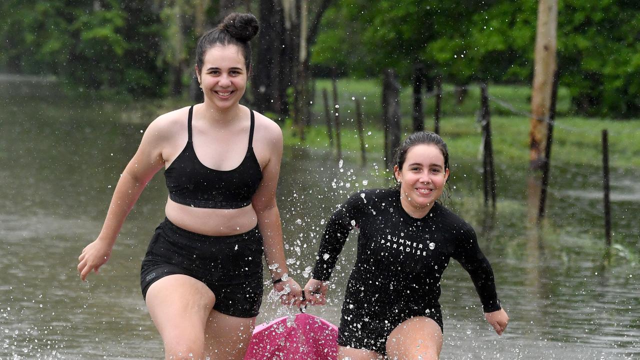 Wet weather in Townsville. Lexie, 16, and Charlie Wendt, 11, enjoy the rain in Kelso. Picture: Evan Morgan