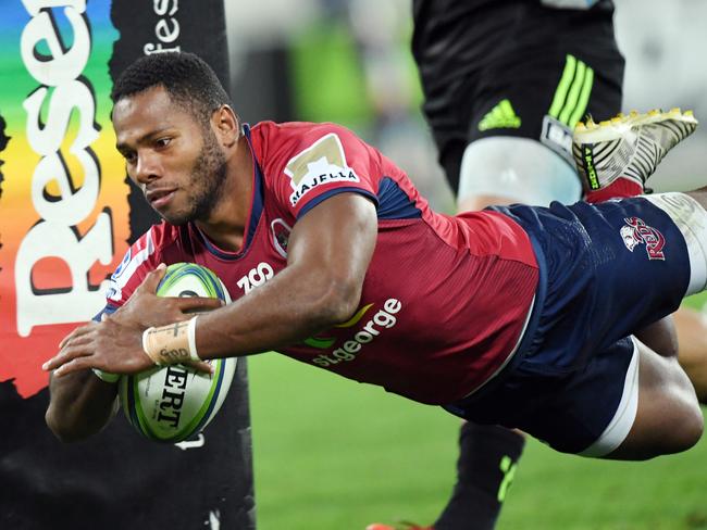 Filipo Daugunu of the Reds dives in to score a try during the Round 14 Super Rugby match between the Hurricanes and the Queensland Reds at Westpac Stadium in Wellington, New Zealand, Friday, May 18, 2018. (AAP Image/SNPA, Ross Setford) NO ARCHIVING, EDITORIAL USE ONLY