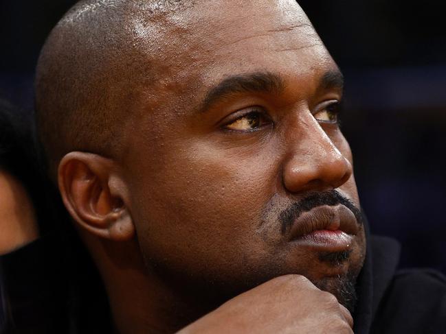 LOS ANGELES, CALIFORNIA - MARCH 11:  Rapper Kanye West and girlfriend Chaney Jones attend a game between the Washington Wizards and the Los Angeles Lakers in the fourth quarter at Crypto.com Arena on March 11, 2022 in Los Angeles, California.  NOTE TO USER: User expressly acknowledges and agrees that, by downloading and/or using this Photograph, user is consenting to the terms and conditions of the Getty Images License Agreement. (Photo by Ronald Martinez/Getty Images)