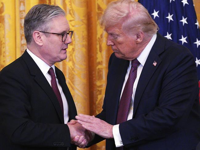 FILE - Britain's Prime Minister Keir Starmer, left, and U.S. President Donald Trump shake hands at a joint press conference in the East Room at the White House Thursday, Feb. 27, 2025, in Washington. (Carl Court/Pool Photo via AP, File)