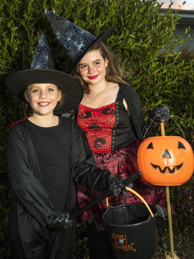 Hannah Paton (left) and Elodie Fairbanks-Smith trick or treating on Halloween in Newtown, Sunday, October 31, 2021. Picture: Kevin Farmer