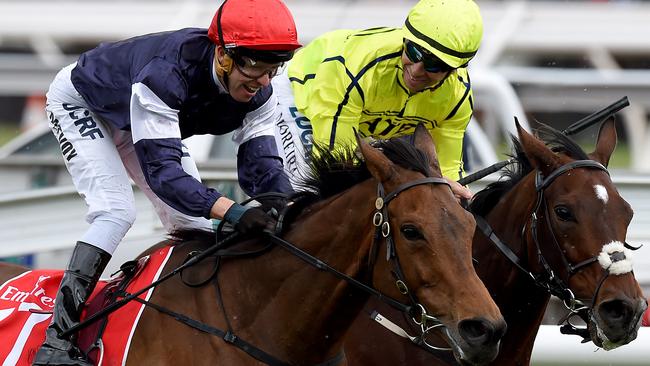 Almandin jockey Kerrin McEvoy, (left), is congratulated by Heartbreak City hoop Joao Moreira.