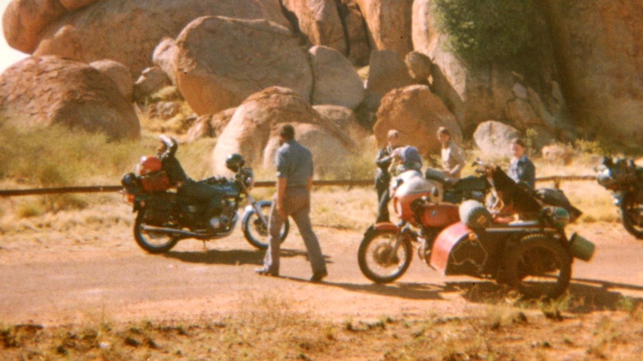 Tim Thomson, Karen Edwards and Gordon Twaddle with dog Tristie at the Devils Marbles.