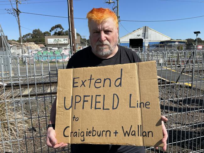 Fawkner resident Mr John Englart joined the local community on Monday to protest for duplicating and extending the Upfield train line to Wallan and Craigieburn.