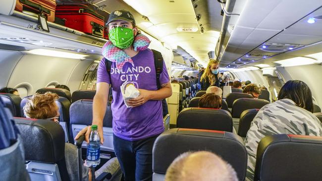 Passengers board an American Airlines flight from San Diego International Airport. Picture: AFP