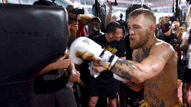 UFC lightweight champion Conor McGregor hits an uppercut bag during a media workout. Picture: Getty