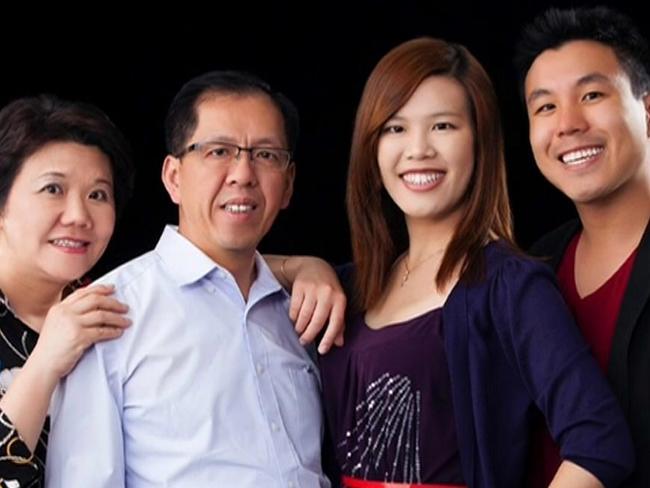 Murdered police employee Curtis Cheng with his wife and children.