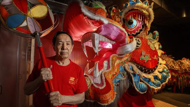 Mark Wang with the 45m-long dragon at the Museum of Chinese Australian. Picture: David Geraghty