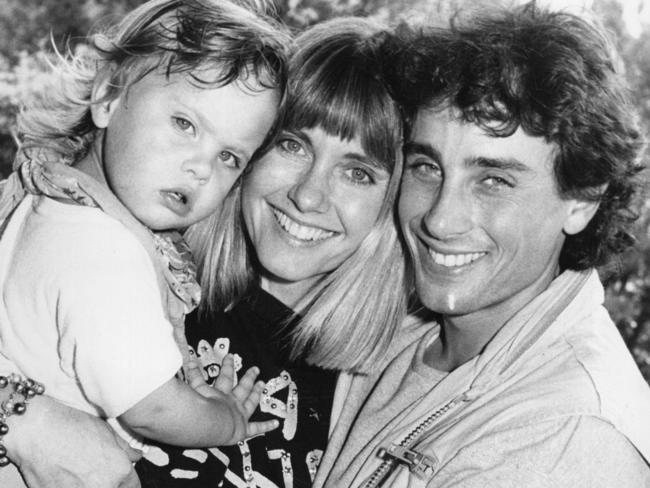 Olivia Newton-John, with daughter Chloe and husband, Matt Lattanzi, arrive at Sydney Airport in 1987. Picture: News Limited