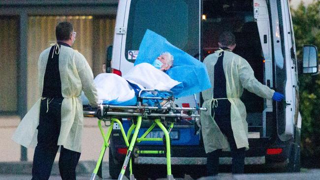 Elderly residents are moved from St Basil's Home for the Aged in Fawkner. Picture: Mark Stewart