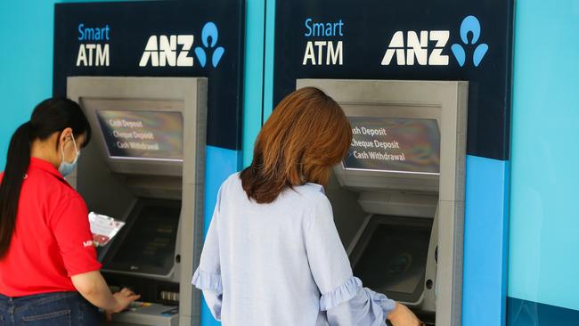 SYDNEY, AUSTRALIA - NewsWire Photos - NOVEMBER 11 2020: A view of young women using an ANZ Bank ATM in the CBD in Sydney Australia. Picture: NCA NewsWire / Gaye Gerard