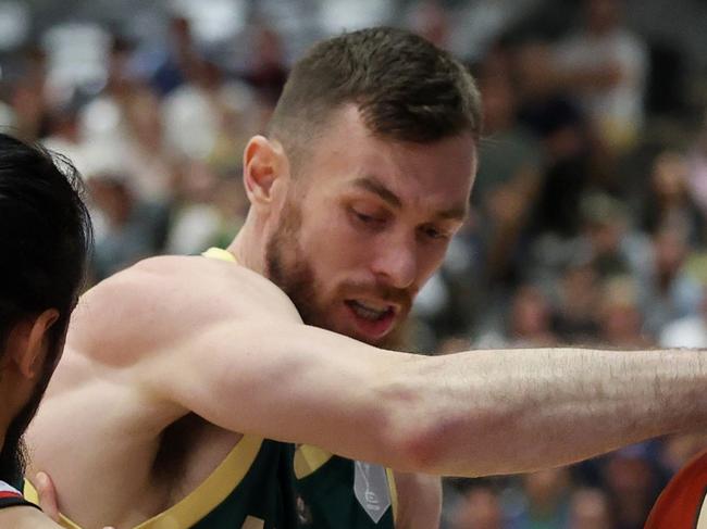 GIPPSLAND, AUSTRALIA - FEBRUARY 20: Nick Kay of Australia and Muhammad Guntara of Indonesia contest the ball during the FIBA Asia Cup Qualifier match between Australia Boomers and Indonesia at Gippsland Regional Indoor Sports Stadium on February 20, 2025 in Gippsland, Australia. (Photo by Daniel Pockett/Getty Images)