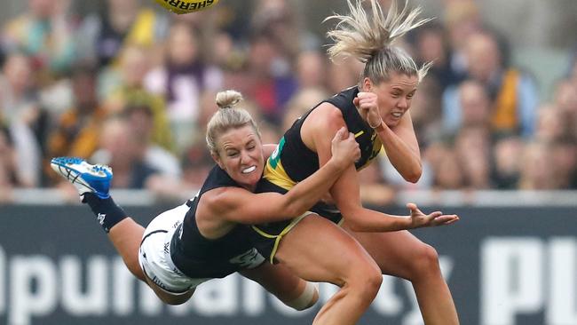 Katie Brennan of the Tigers is tackled by Carlton’s Katie Loynes.