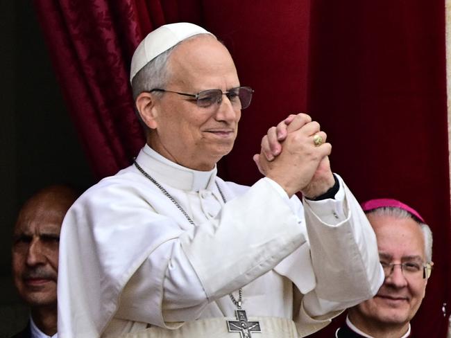 TOPSHOT - Pope Leo XIV gestures after delivering the Regina Caeli prayer from the main central loggia of St Peter's basilica in The Vatican, on May 11, 2025. (Photo by Tiziana FABI / AFP)