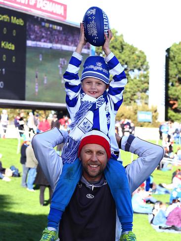 Ricky Thomson sits on the shoulders of his father, Stu Thomson, both of Perth, WA.