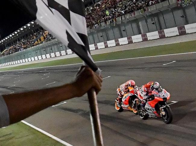 Andrea Dovizioso beats Marc Marquez to the win in Qatar. Pic: MotoGP.com