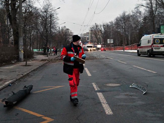 A medical worker walks past a fragment of missile after an air strike that hit Kyiv's main television tower in Kyiv. Picture: AFP