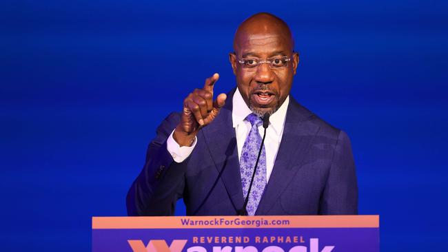 Raphael Warnock says a run-off means ‘we’ll soldier on for a few more weeks’. Picture: AFP