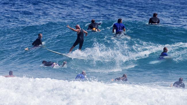 Surfers having to ride through other surfers as large swell brings large crowds to Snapper Rocks on Sunday 2 January 2022. Picture: Jerad Williams