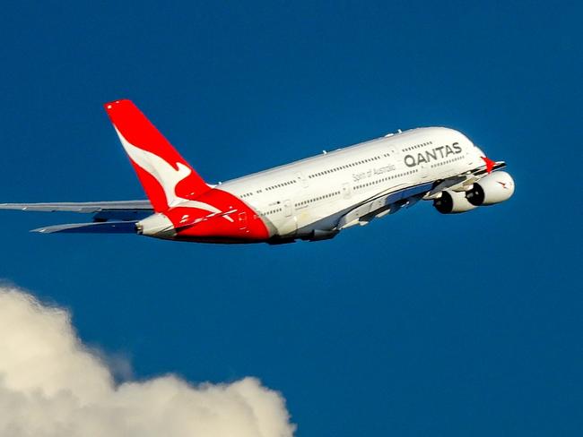 A Qantas Airbus A380-842, registration VH-OQK, has taken off to the west from Sydney Kingsford-Smith Airport and climbing above the clouds.  She is heading to Singapore as flight QF1.  This image was taken from Nigel Love Bridge off Airport Drive, Mascot on a sunny and windy afternoon on 8 April 2023.Escape 16 June 2024Why I TravelPhoto - iStock