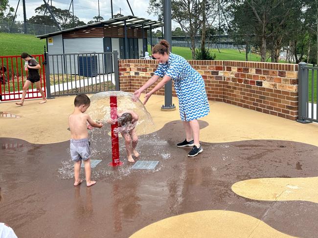 Lisa Johnstone and her two sons, Ben and Jack, enjoy the new water splash zone. Picture: Tileah Dobson