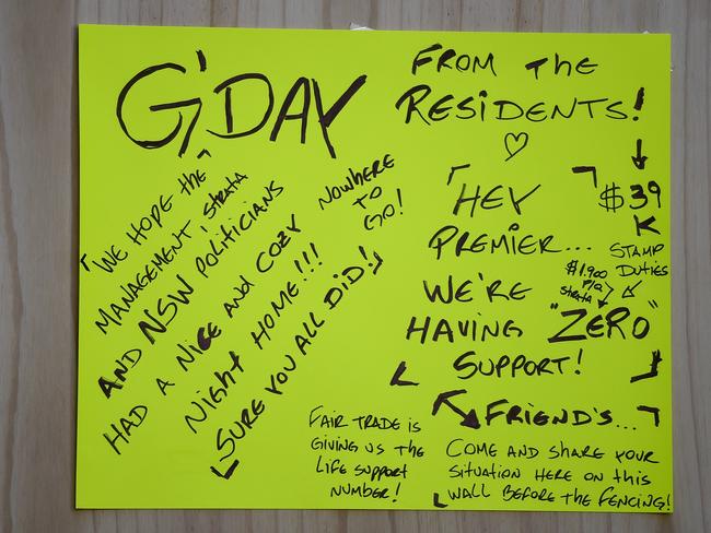 A sign from residents at the entrance of the Mascot Towers.