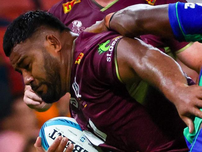 Queensland Reds' Taniela Tupou (L) is tackled by Fiji Druas Mesulame Dolokoto (R) during the Super Rugby match between the Queensland Reds and Fijian Drua at Suncorp Stadium in Brisbane on March 12, 2022. (Photo by Patrick HAMILTON / AFP) / -- IMAGE RESTRICTED TO EDITORIAL USE - STRICTLY NO COMMERCIAL USE --