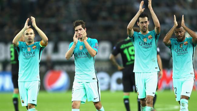 FC Barcelona players applaud the fans after the UEFA Champions League group match.