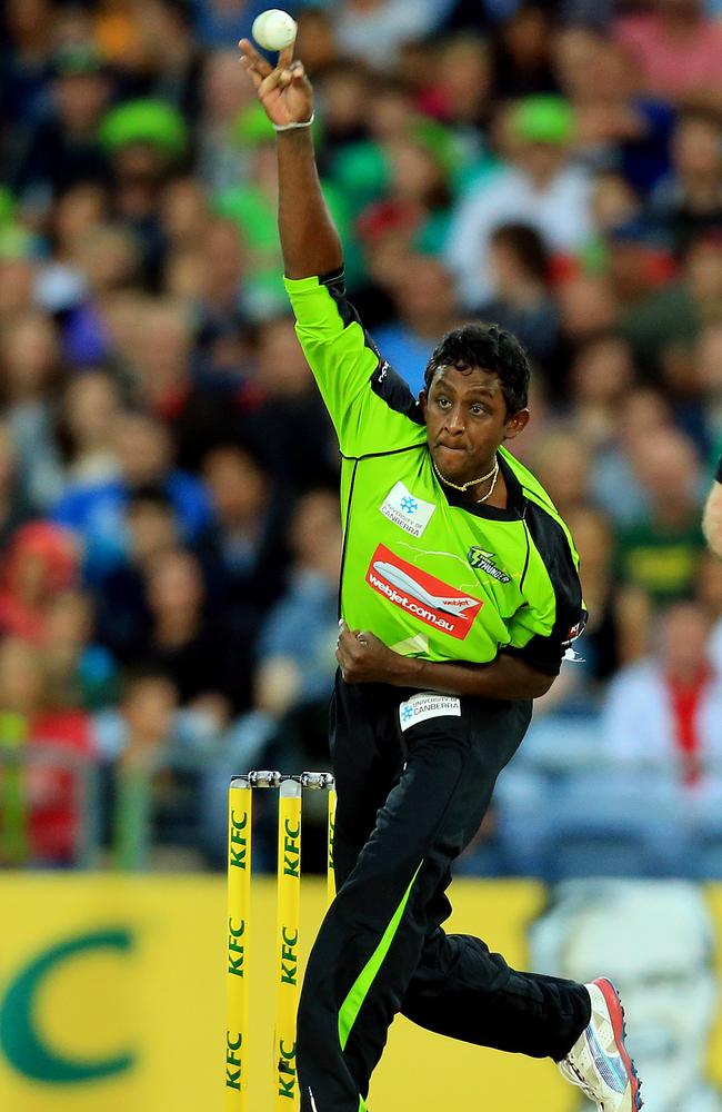 Ajantha Mendis bowling for Sydney Thunder in the Big Bash League.